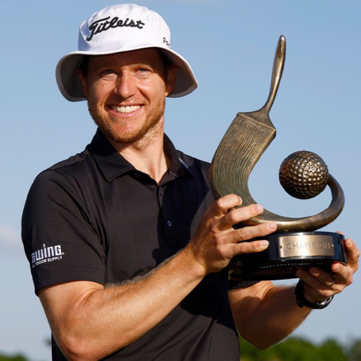 Valspar Championship winner Peter Malnati and trophy by Malcolm DeMille